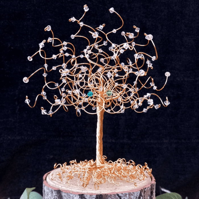 Close up of gold wire and crystal tree cake topper