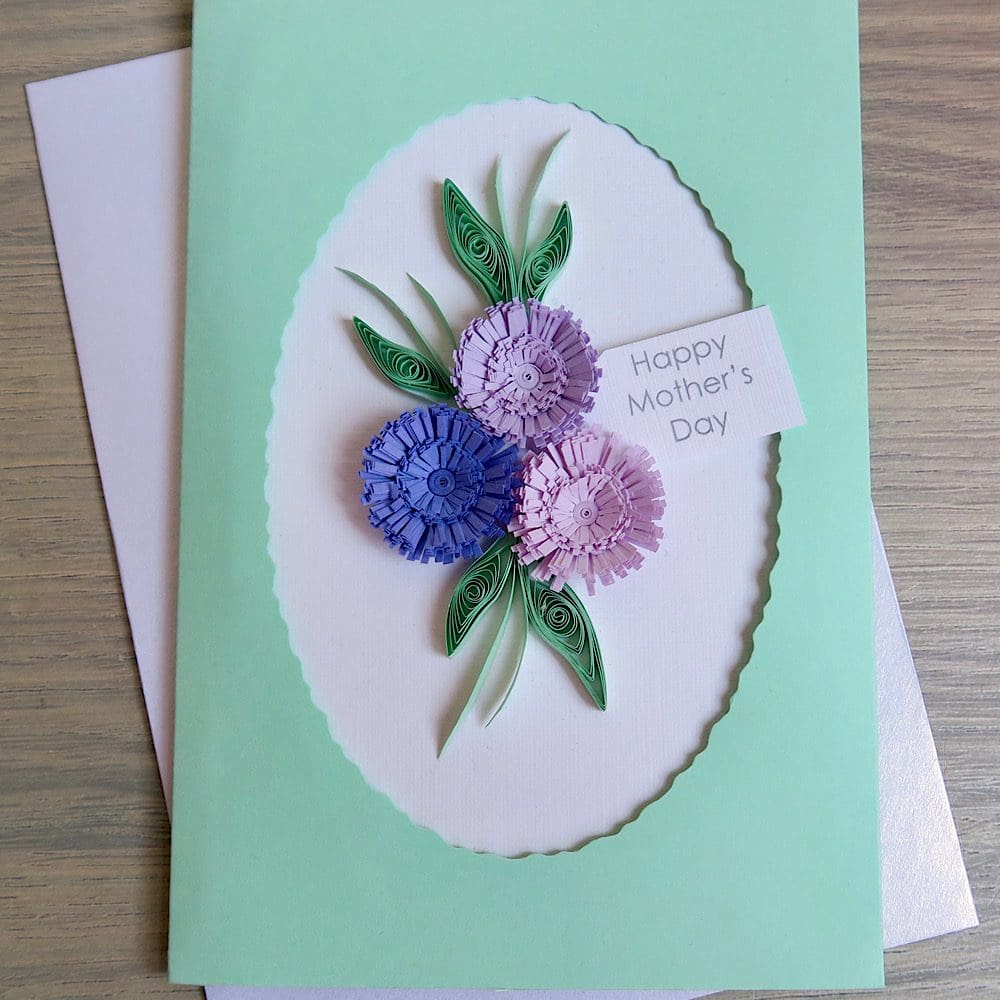 Close up of quilled Mother's Day card in shades of lilac