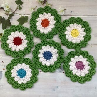 Crochet rainbow flower coasters