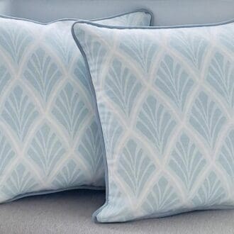Two square cushions in Florin fabric and with velvet piping.