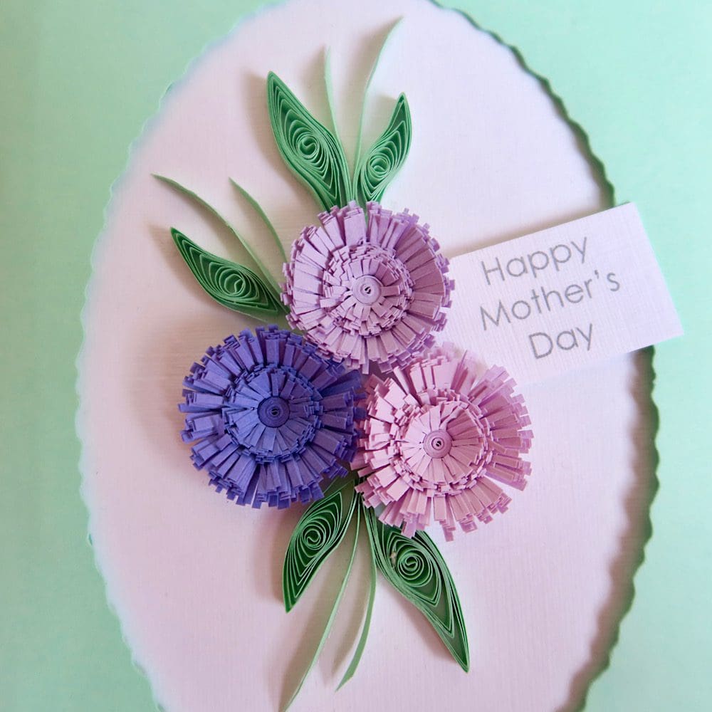 Close up of quilled Mother's Day card in shades of lilac