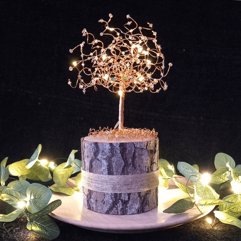 Gold wire and crystal tree cake topper lit with micro-lights.
