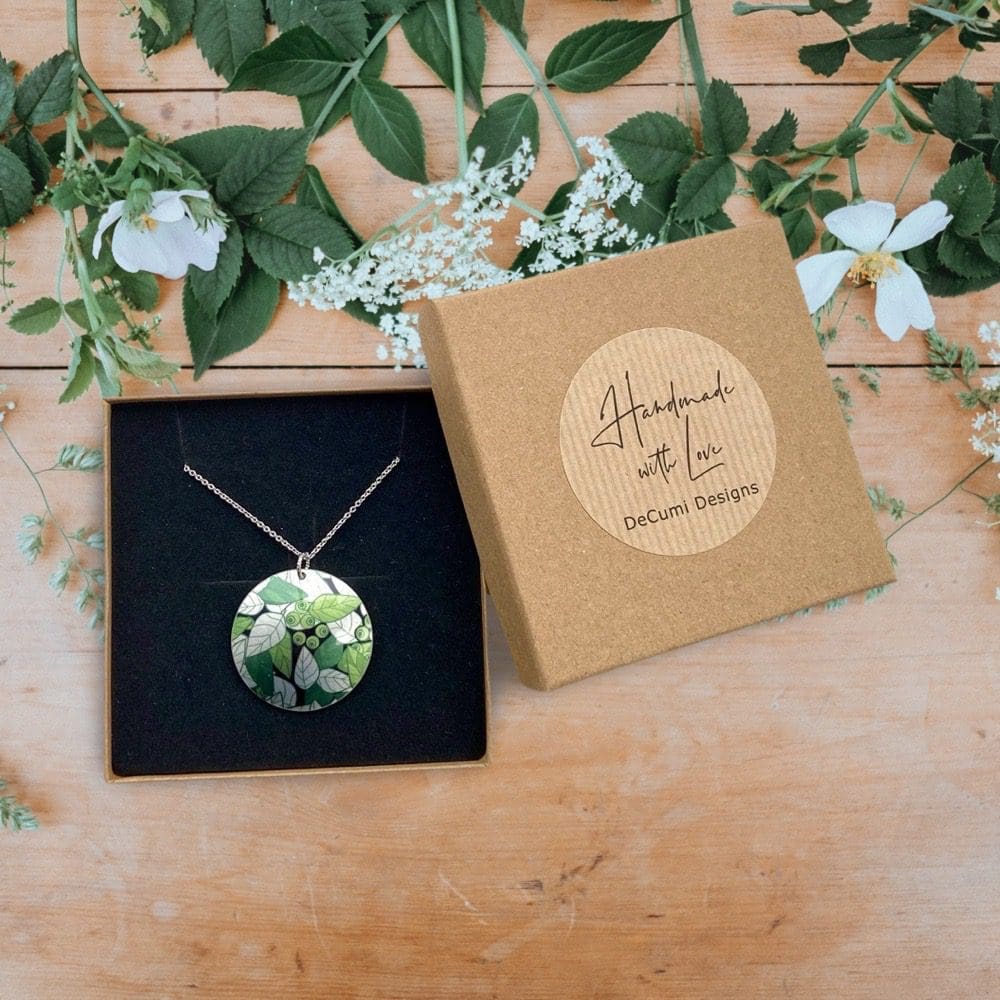 Pendant. necklace, artistic, olive green leaves, handmade jewellery, aluminium, metal, round, disc, circle, medallion