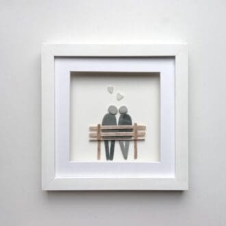 pebble couple sitting on a wooden bench anniversary gift