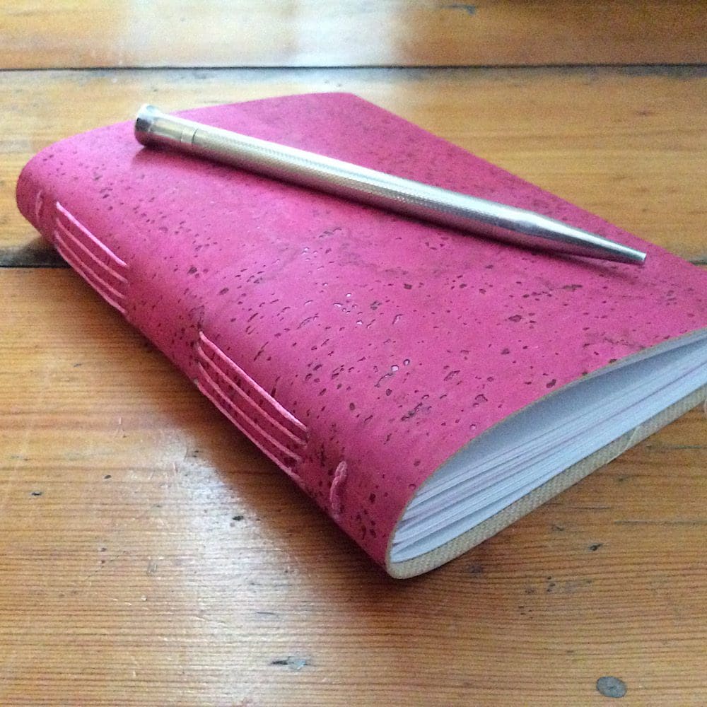 Raspberry Coloured A6 Soft Cover Cork Journal with recycled plain white paper