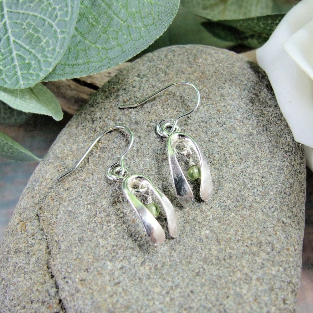silver snowdrop earrings with peridot