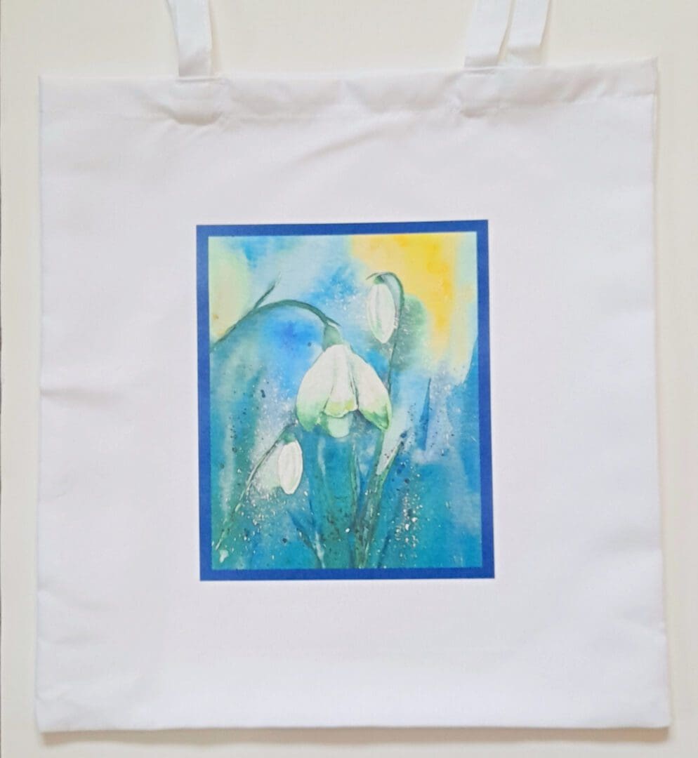 White tote bag with snowdrop artwork