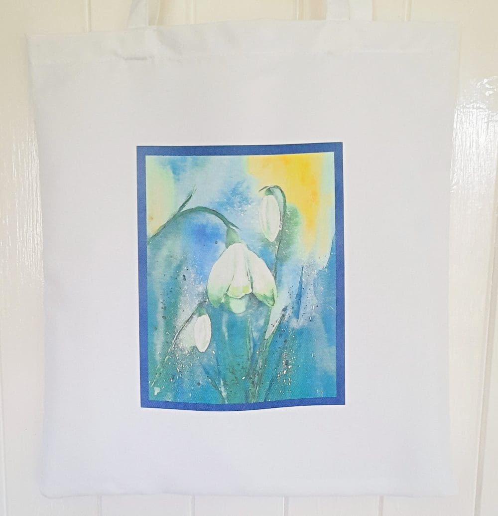 White tote bag with snowdrop artwork