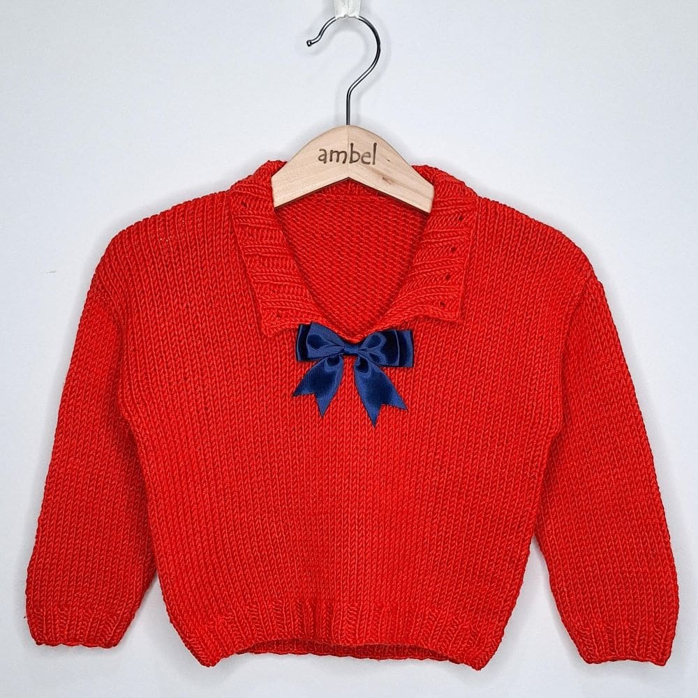 An Ambel Crafts Orange/red collared handknitted jumper. Suitable for girl or boy 2-4 years old.