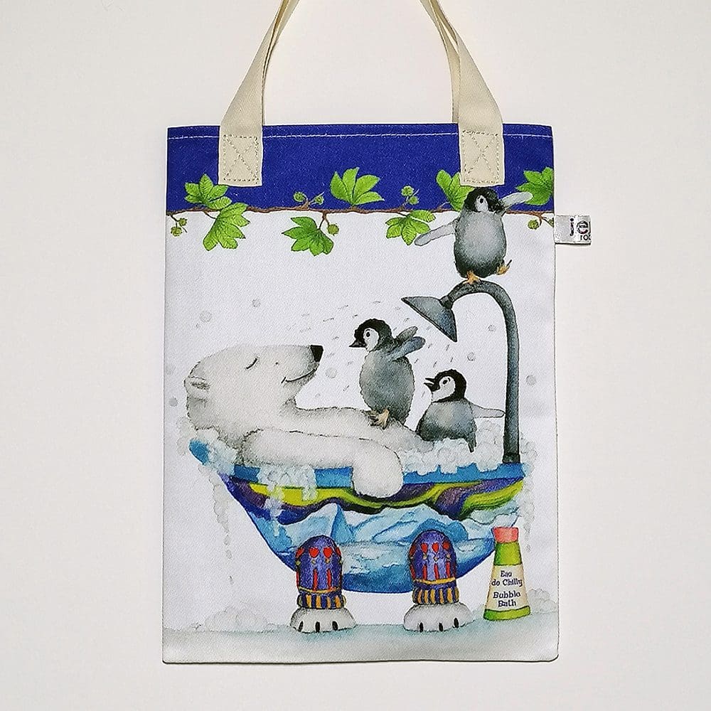 Polar bear and triplet penguins bookbag. On the front featuring three penguins bothering a chilled polar bear sharing a bubble bath. On reverse is the 'Love and Friendship logo with a little close up of Pip polar bear and Walter penguin. Bright blue trim on top edge and pale cream cotton handles.