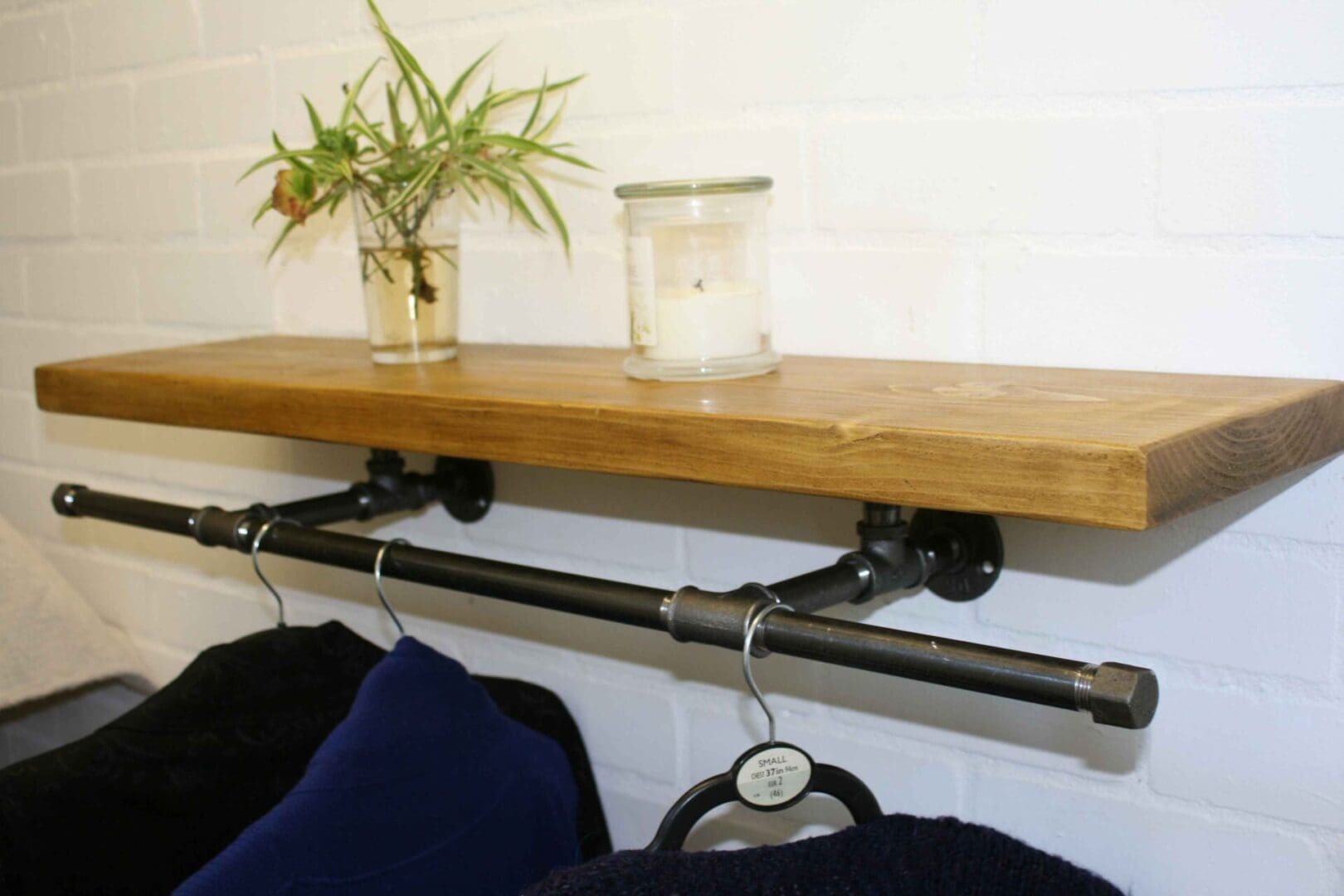 industrial pipe rail and rustic waxed bookshelf tbch