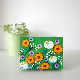 Green jewellery box with wild meadow flowers hand-painted in acrylic