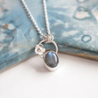 Sterling silver and labradorite gemstone necklace with a little silver flower.