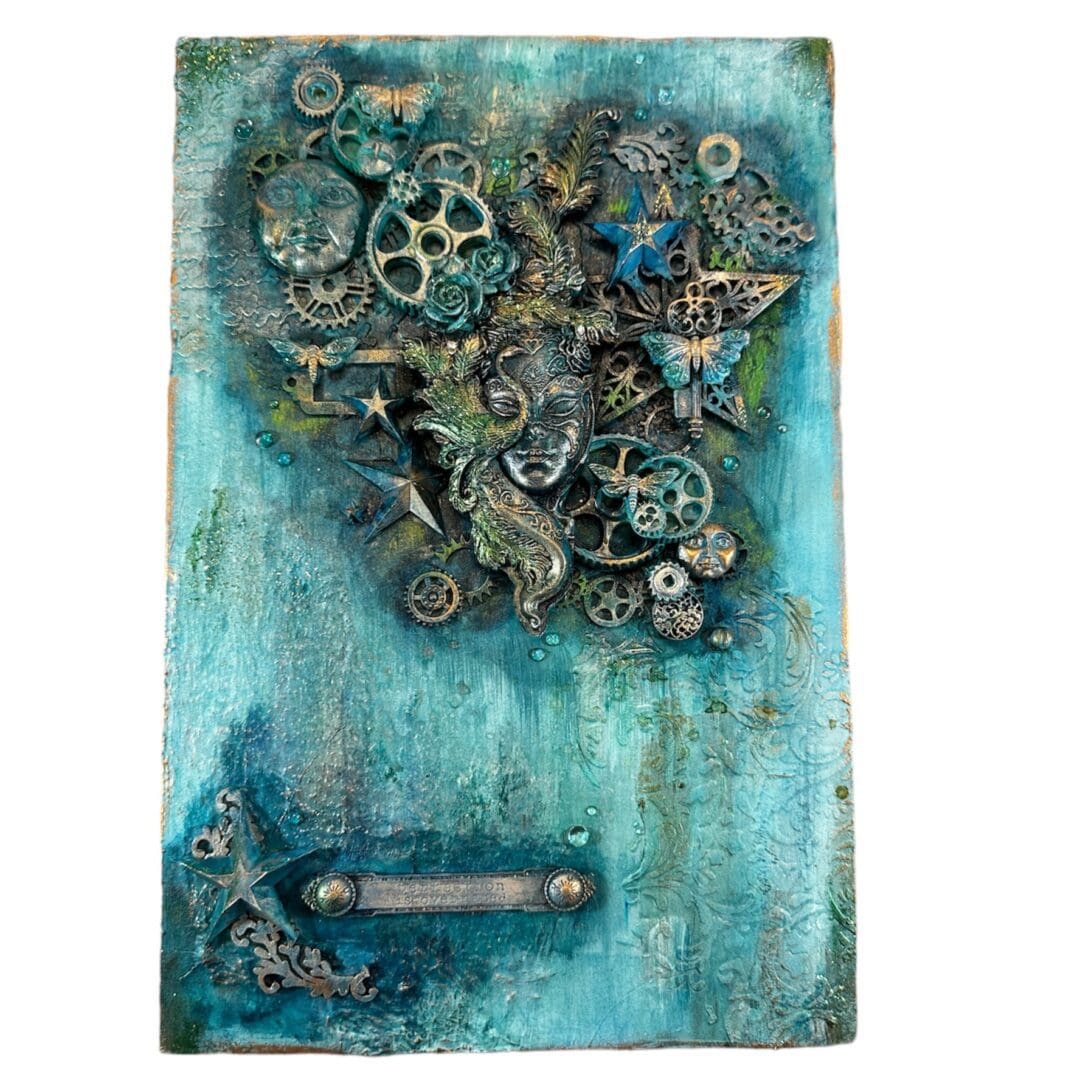 An original mixed media artwork in turquoise shades. It has lots of depth and texture. it features a womans face with a peacock mask.