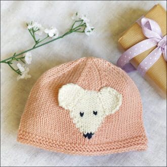 Baby beanie in peach pink with mouse motif