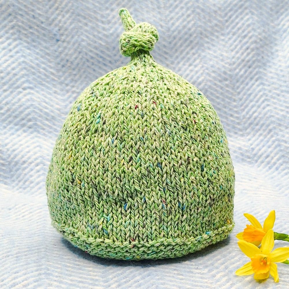 Green heathered knit beanie with a Peter Pan feel