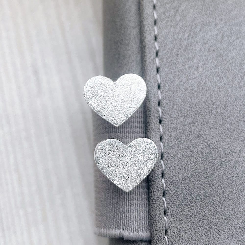 Large heart shaped studs with sparkly texture