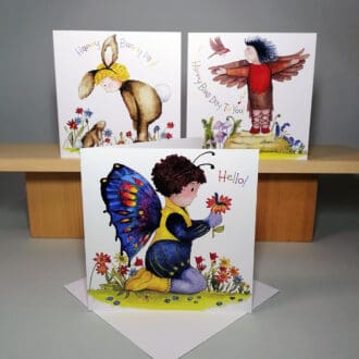 Set of three high quality, square greeting cards featuring the Bath Street Babies - toddlers dress in their favourite colourful costumes: a butterfly, bird and a rabbit with their little creature friends.