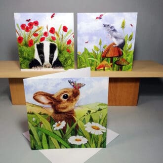 Set of three high quality, square greeting cards featuring British Wildlife, a badger cub, young rabbit and a grey mousie set in the countryside