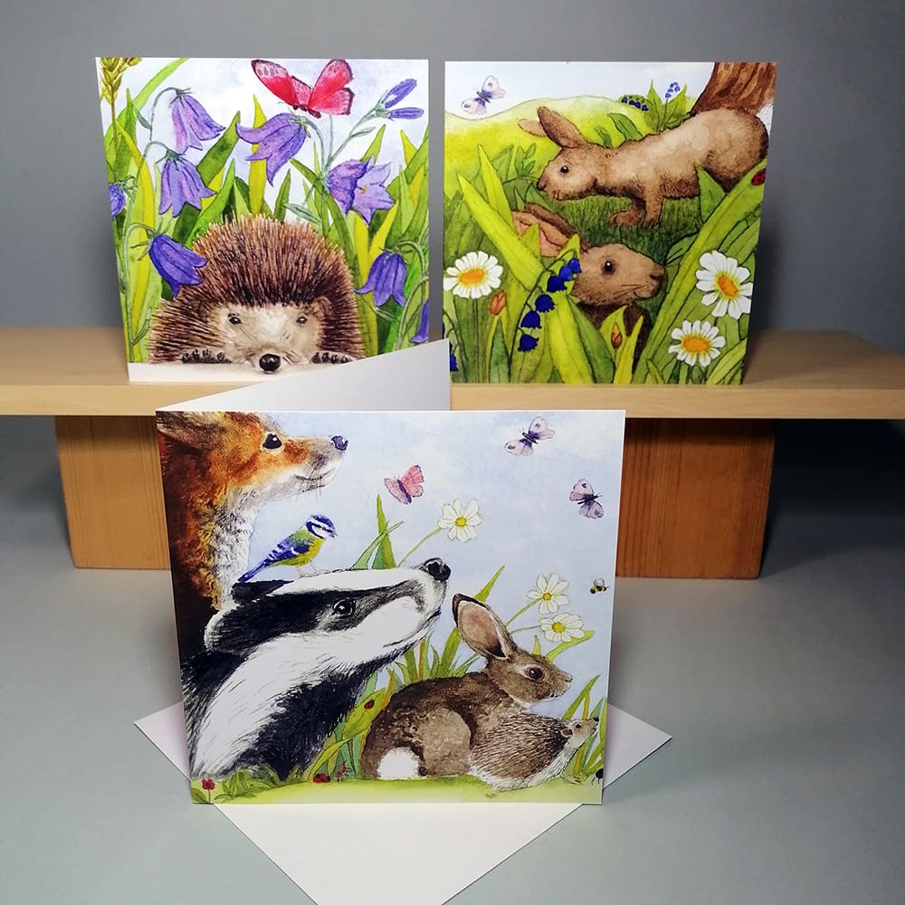Set of three high quality, square greeting cards featuring British Wildlife, a hedgehog, two rabbits and a group of wildlife friends set in the countryside