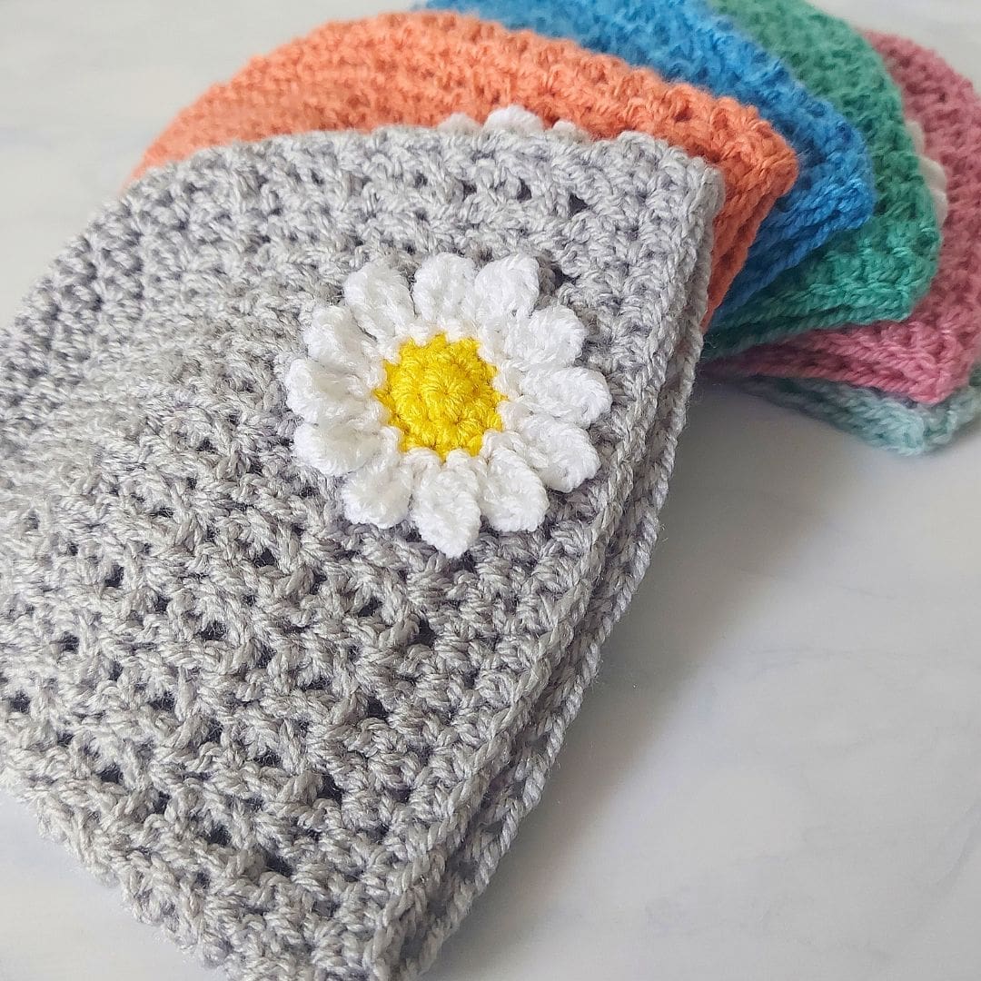 Crochet daisy beanie hats in sizes from newborn through to toddler size. handmade in a variety of colours to suit any baby!