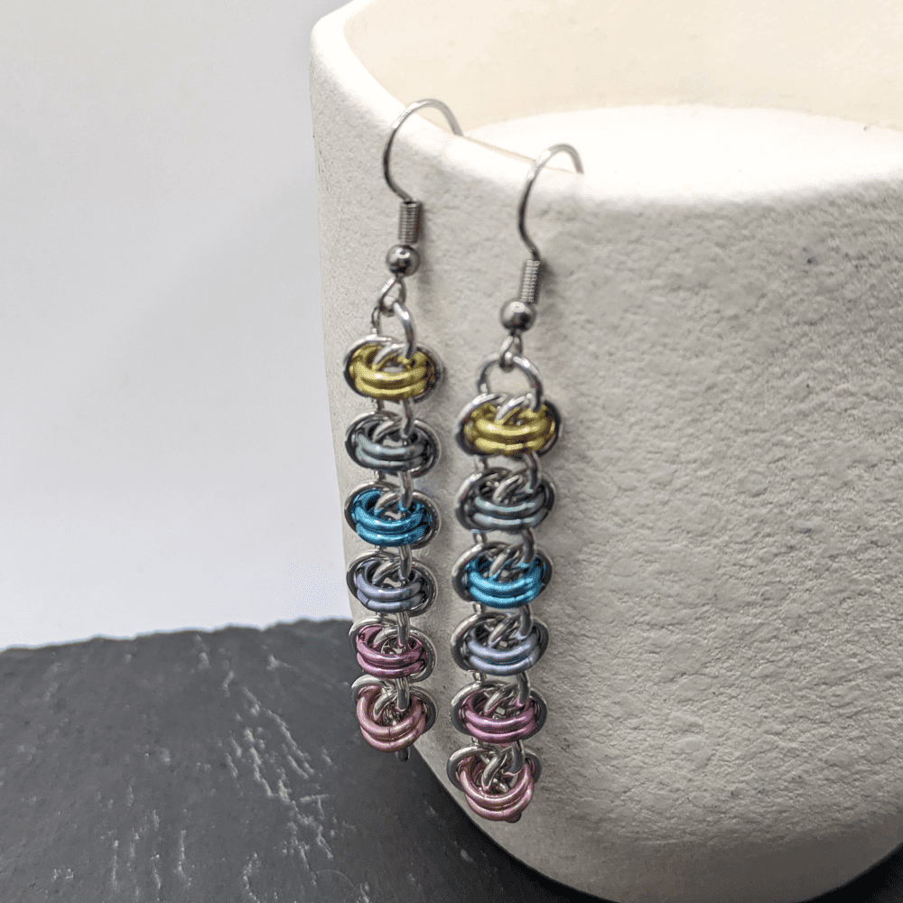 Chainmaille earrings made with silver and pastels coloured aluminium rings made in the barrel weave
