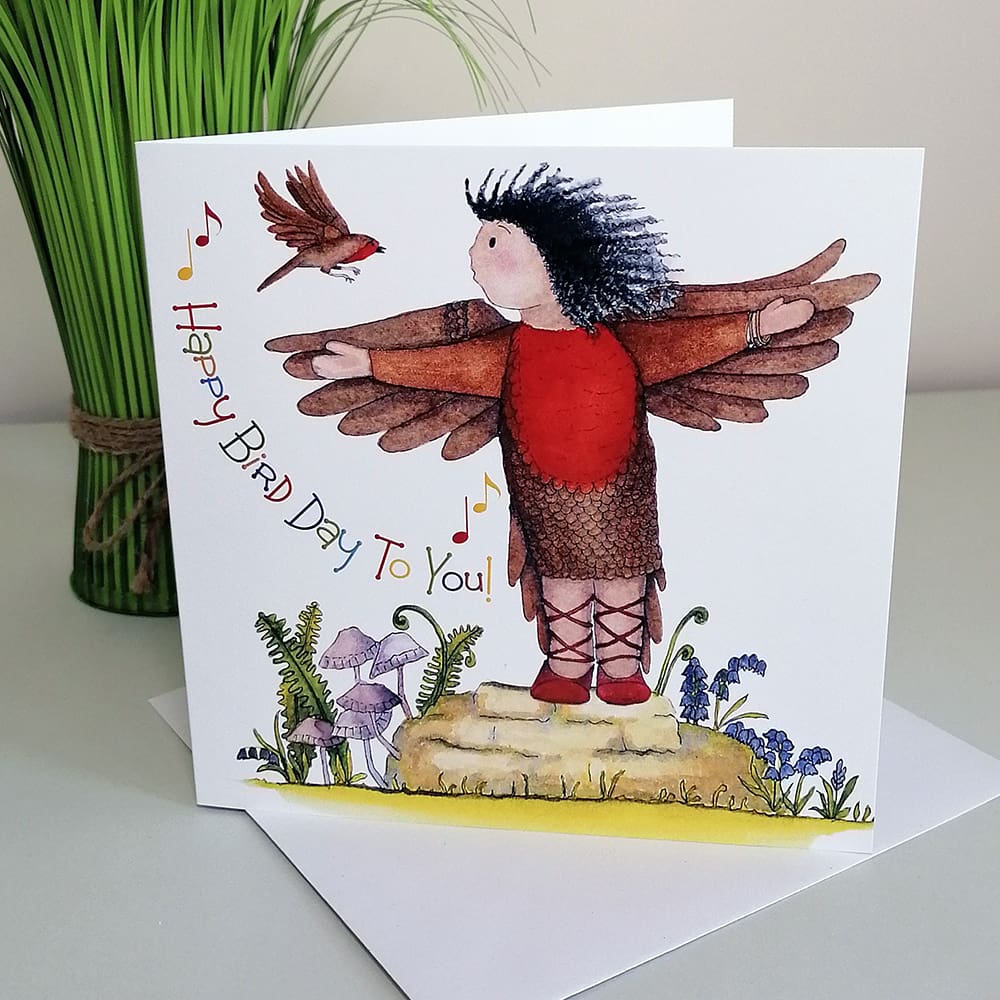 Square, whimsical greetings card for kids featuring Michaela in her red and brown bird costume discussing flying with Robbie the robin in the garden.
