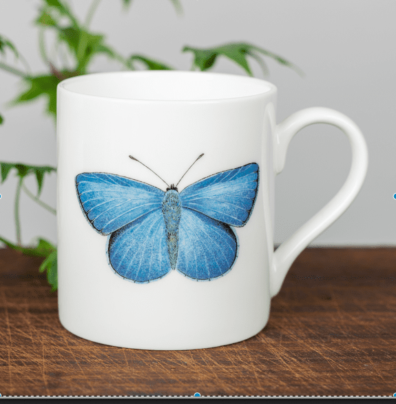 Fine bone china mug with a single blue butterfly on the front and a smaller one of the back