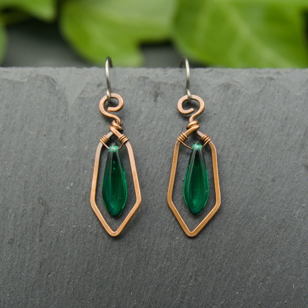 Handcrafted copper drop earrings with green glass beads