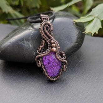 Copper wire wrapped pendant with purple dichroic glass