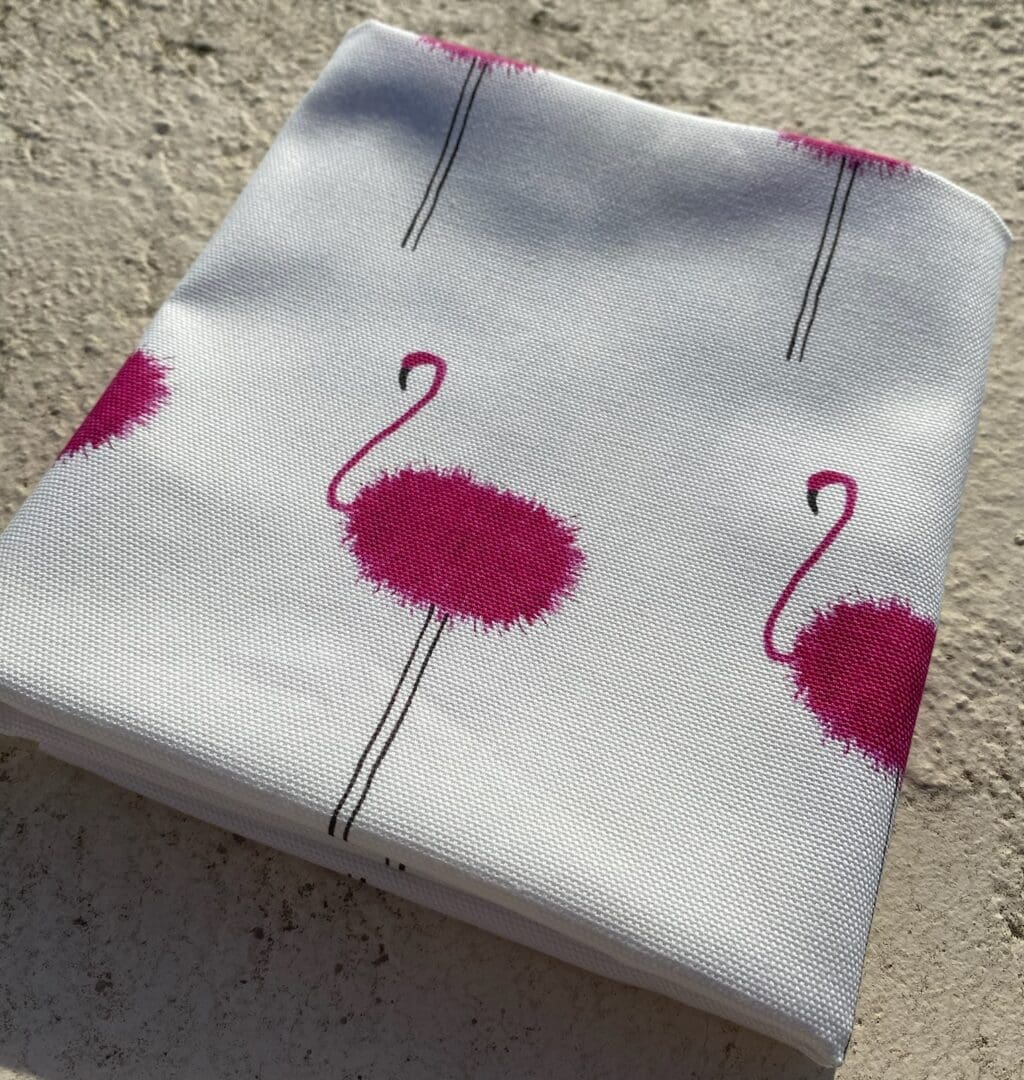 100% Printed Cotton White Teatowel with repeated Pink Flamingo pattern