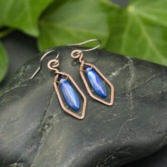 Handmade copper earrings with blue glass beads