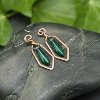 Handmade geometric copper earrings with green glass dagger beads