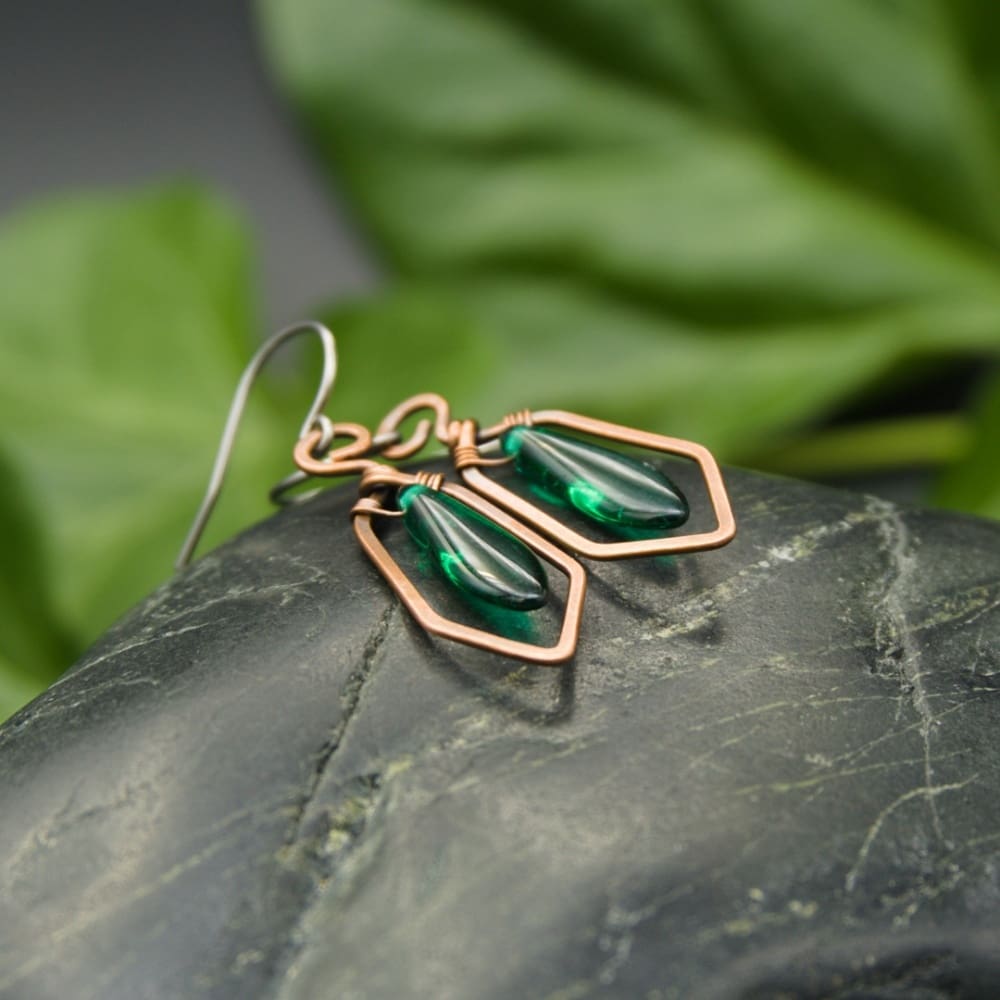 Copper drop earrings with translucent green glass beads