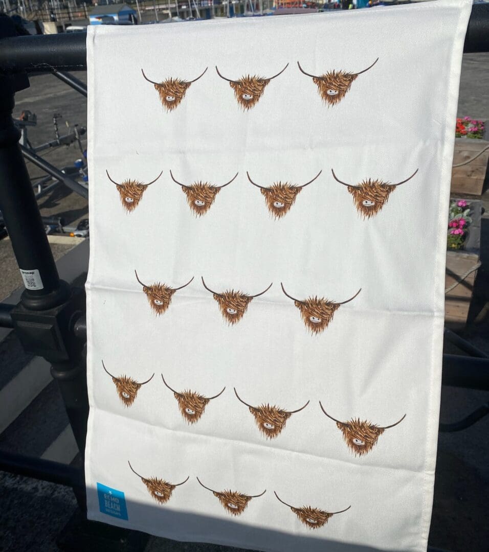 100% Cotton White Teatowel with repeated Highland Cow pattern