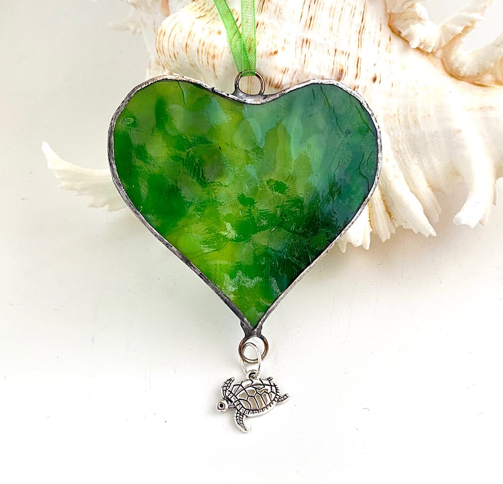 Green turtle shell like glass heart with turtle charm