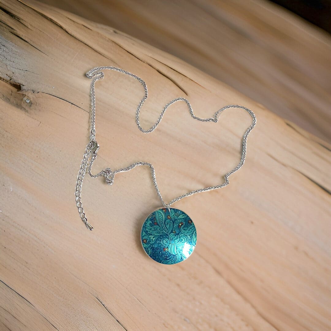Teal, necklace, pendant, paisley, patterned, round, disc, aluminium, handmade jewellery, UK