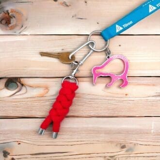 Red chunky rope keyring displayed on a bunch of keys on a light woodn background