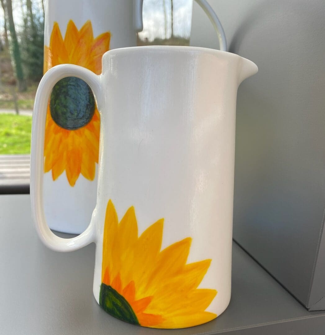 Medium sized Sunflower Ceramic Jug with Tall Jug in background