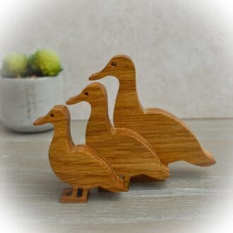 Set of three wooden ducks ornament.