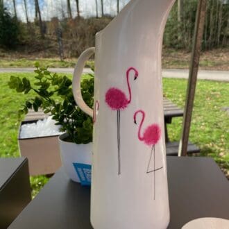 Tall white ceramic jug with hand painted flamingos