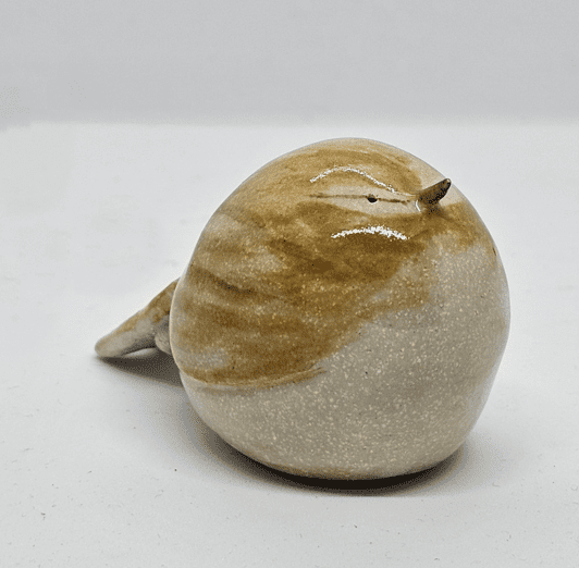 Front side view of ceramic chiffchaff on a white background