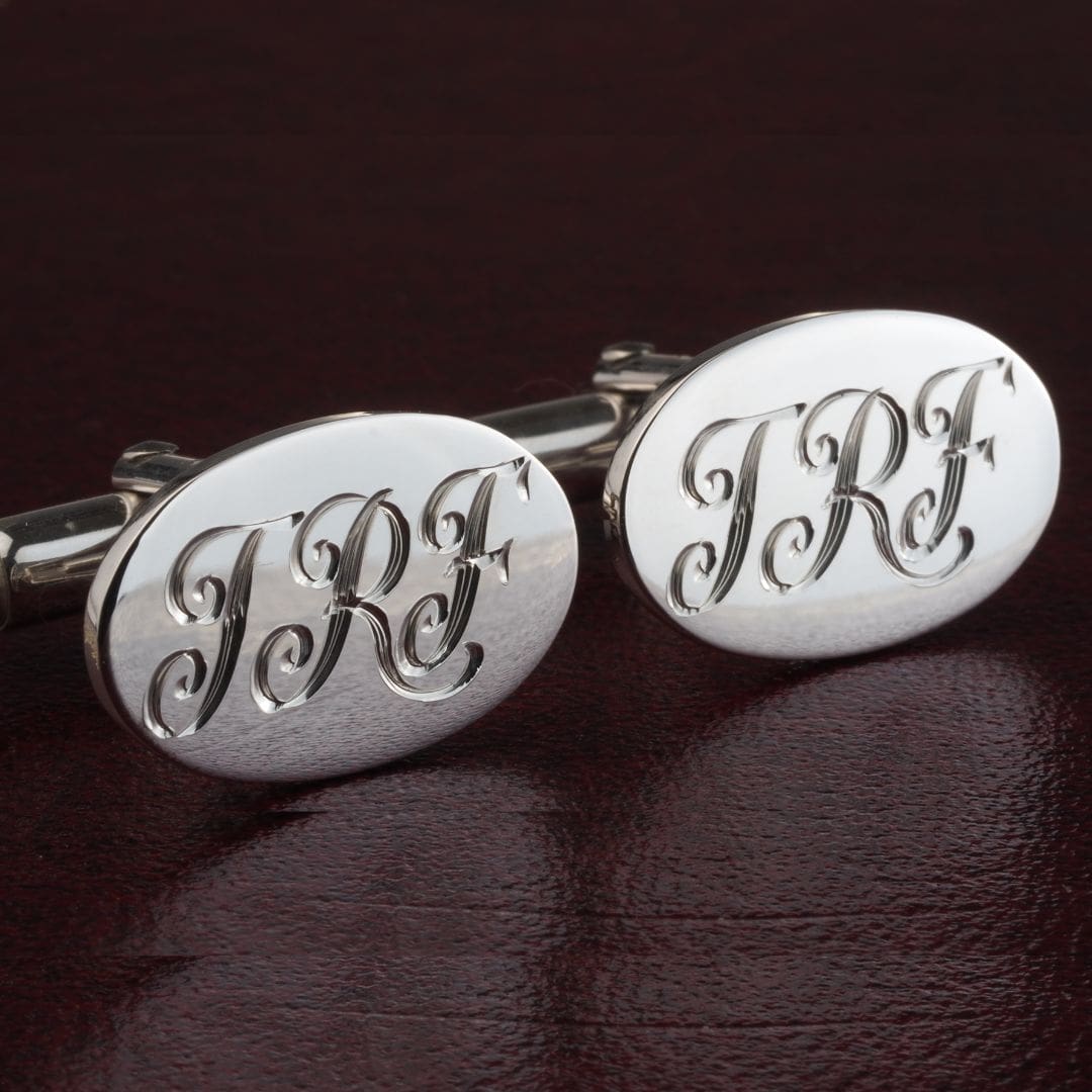 engraved separate script initials on silver cufflinks