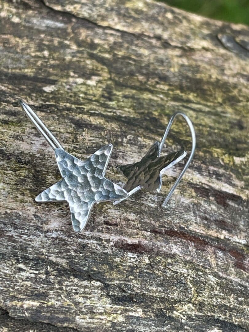 Sterling silver hammered star drop earrings