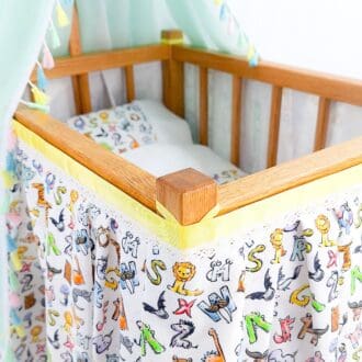 A dolls cot for children to play like mummy and but dolls and teddy bears to bed