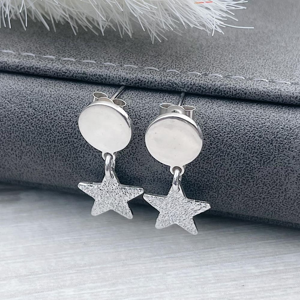 Sterling silver textured star earrings