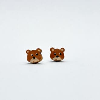 cute brown bear earrings on white background