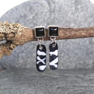Square onyx gemstones with black and white enamel earrings