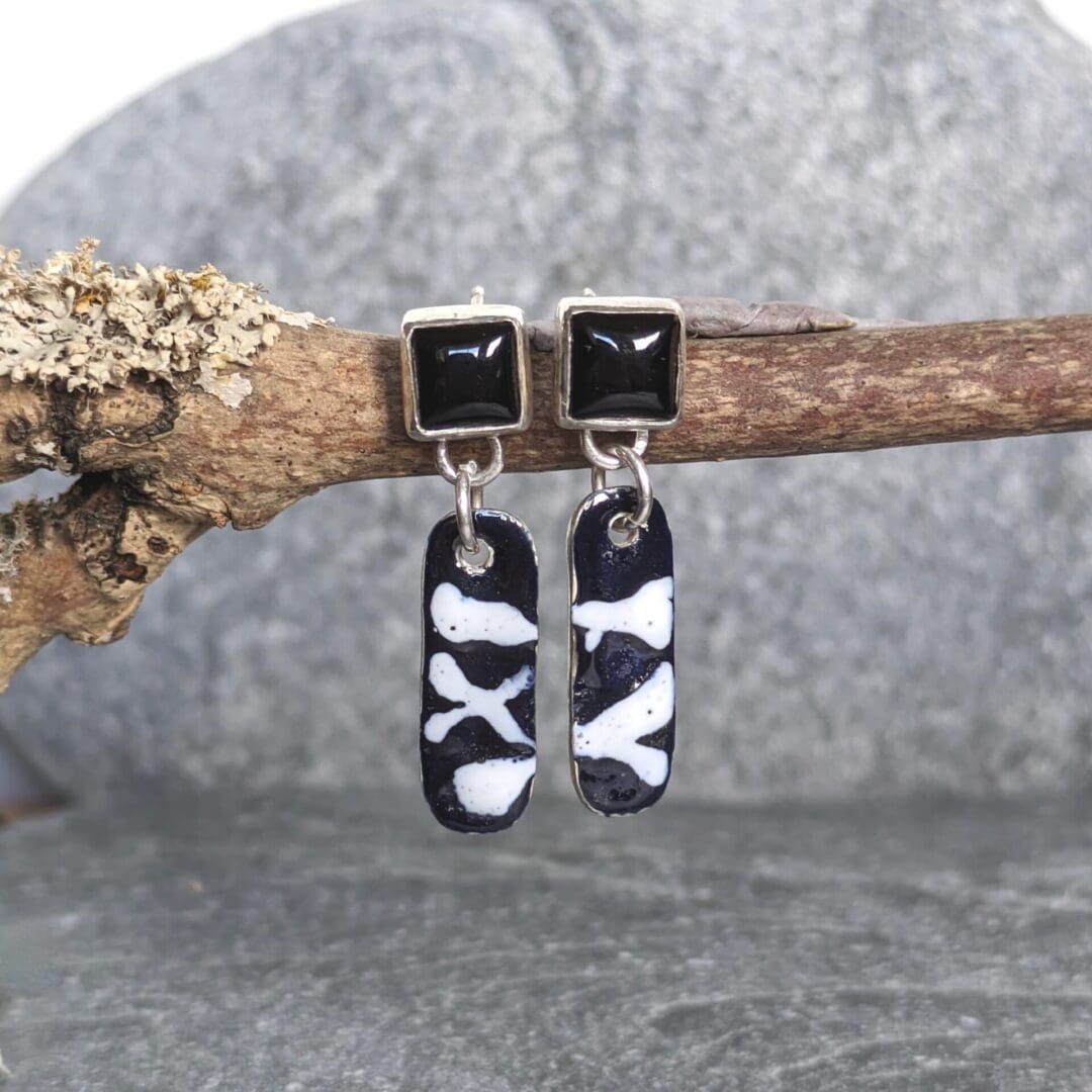 Square onyx gemstones with black and white enamel earrings