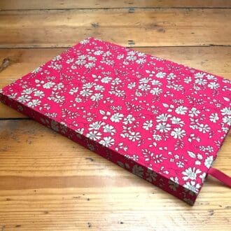 A5 hard cover handmade notebook filled with lined paper covered in Liberty fabric